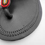 African lays up sandals