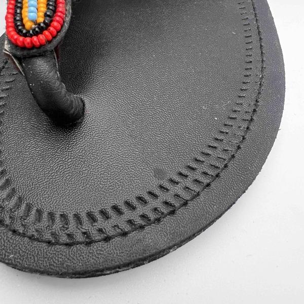 African lays up sandals