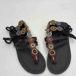 African lays up sandals