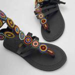 African lays up sandals