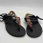 African lays up sandals